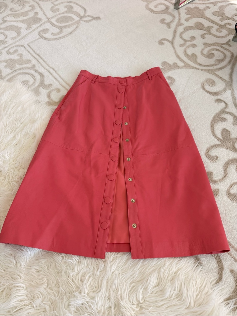 Women's A-Line Skirt in Coral Pink. 100% leather